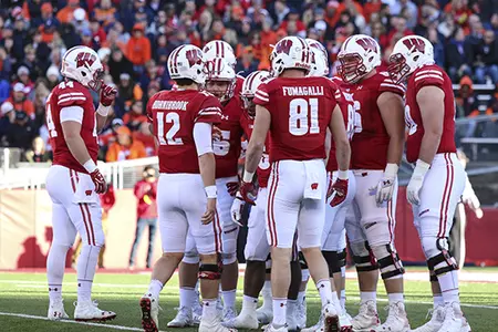 Photo of a Wisconsin football offesnive huddle vs. Illinois 2016 with Alex Hornibrook and Troy Fumagalli