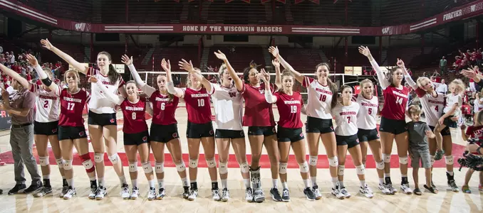 The Badger volleyball team sings Varsity in the UW Field House after the intrasquad scrimmage.