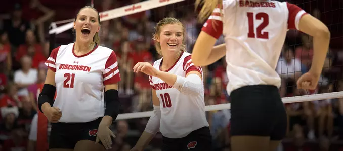 Freshmen Grace Loberg, Mariah Whalen and Nicole Shanahan celebrate on the court.