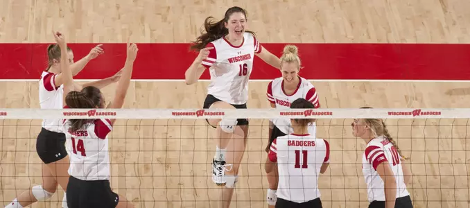 The Badger volleyball team celebrates a point won on the court.