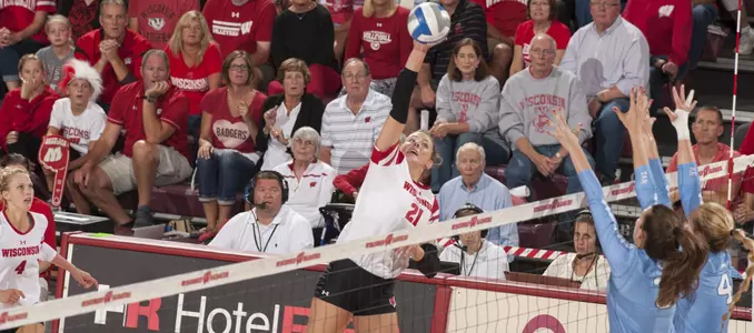 Grace Loberg goes up for a kill during a match in the UW Field House.