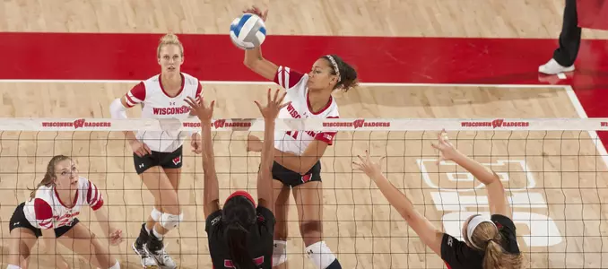 Tionna Williams goes up for a middle attack at the net.