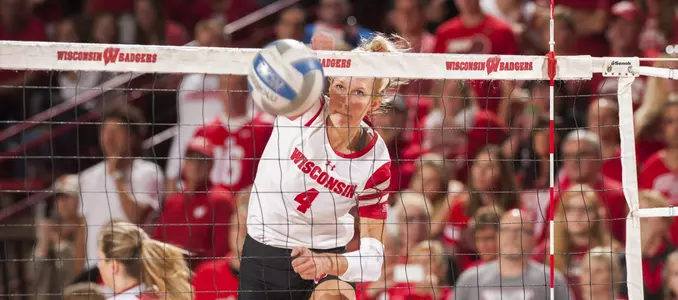 Kelli Bates attacks the volleyball during warm ups.