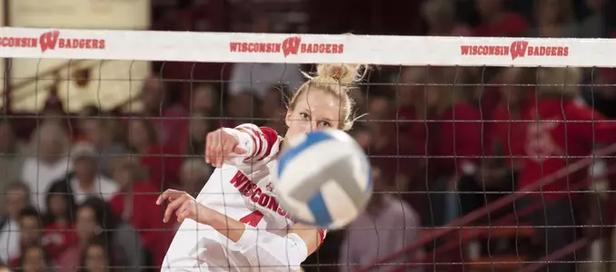 Kelli Bates attacks the volleyball during warm ups.