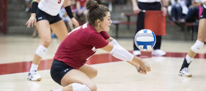 M.E. Dodge goes to her knees for a dig.