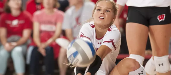 Riley Bell digs a ball during a match.