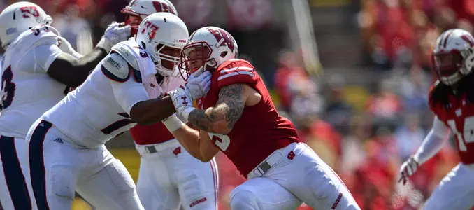 Photo of Garret Dooley playing defense during football game vs. Florida Atlantic 2017