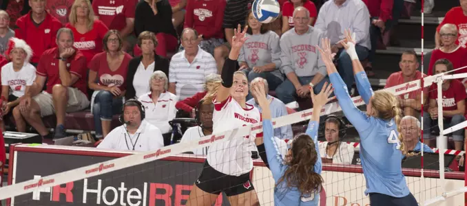Grace Loberg goes up for a kill during a match in the UW Field House.