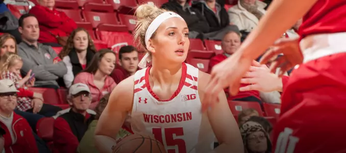 Lexy Richardson looks to pass the ball during a game at the Kohl Center.