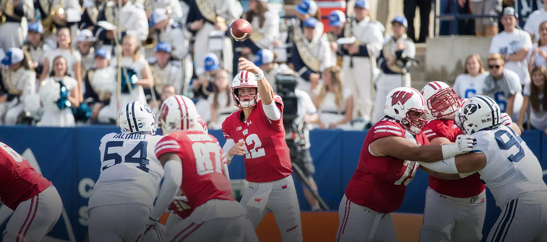 Photo of Alex Hornibrook passing the ball to Quintez Cephus during Wisconsin football game at BYU Sept. 16, 2017
