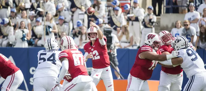 Photo of Alex Hornibrook passing the ball to Quintez Cephus during Wisconsin football game at BYU Sept. 16, 2017