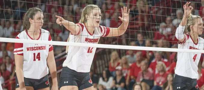 Nicole Shanahan waits at the net to block.