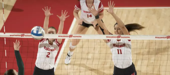 Sydney Hilley and Dana Rettke attempt to block a Michigan State attack.