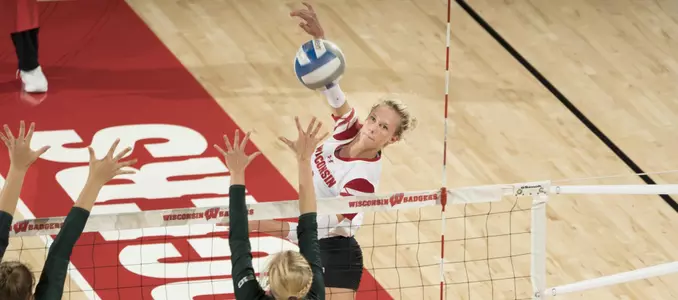 Kelli Bates attacks the ball against to MSU blockers.