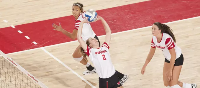 Sydney Hilley sets the ball while Tionna Williams and Madison Duello look to attack.