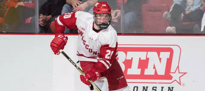 Josh Ess carries the puck