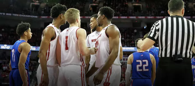 Badgers huddle during a game against UMass Lowell