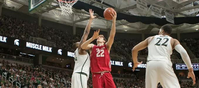 Ethan Happ goes for a layup at Michigan State