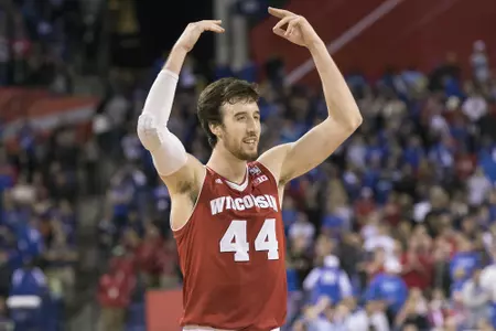 Frank Kaminsky raises his arms in excitement against Kentucky in 2014