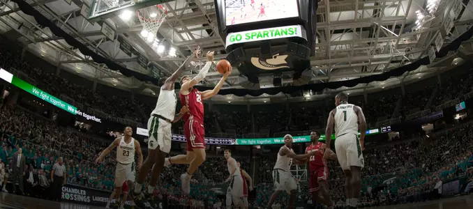 Ethan Happ goes for a layup during a game at Michigan State