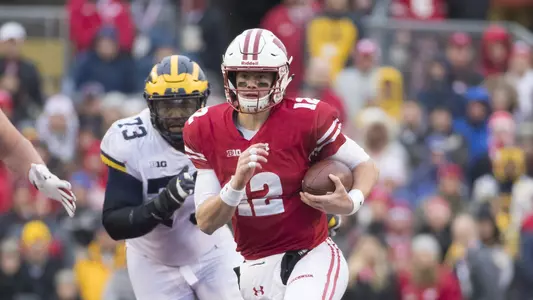 Wisconsin Badgers quarterback Alex Hornibrook (12) carries the ball during an NCAA College Big Ten Conference football game against the Michigan Wolverines Saturday, November 18, 2017, in Madison, Wis. The Badgers won 24-10. (Photo by David Stluka)