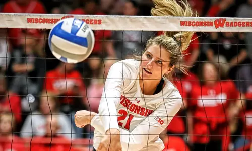 Grace Loberg attacking the ball through the net