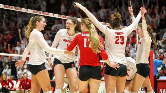 Volleyball team celebrates against Nebraska