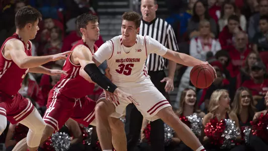 Nate Reuvers and Ethan Happ play against each other in the 2018 Red/White men's basketball scrimmage at the Kohl Center