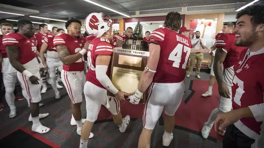 Wisconsin Badgers teammates Vince Biegel (47) and Connor Udelhoven (60) carry the Freedom Trophy back to the locker room after an NCAA Big Ten Conference college football game against the Nebraska Cornhuskers Saturday, October 29, 2016, in Madison, Wis. The Badgers won 23-17 in overtime. (Photo by David Stluka)