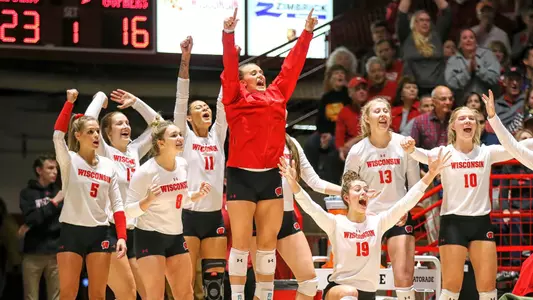 The Badger bench celebrates during a match.