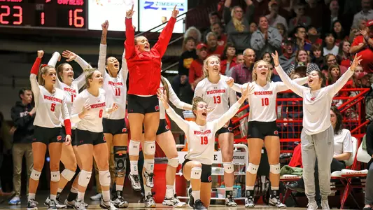 Volleyball team celebrates against Minnesota