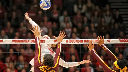 Dana Rettke hits over two Minnesota blockers.