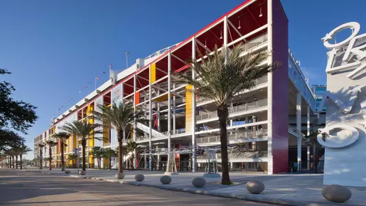 Camping World Stadium Orlando, Florida - neon Orlando sign outside the stadium with palm trees