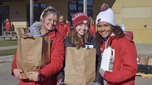 Badgers Give Back - UW student-athletes Reiley Peters (softball), Saylor Martin (rowing) and Tyra Turner (softball) help carry groceries at Goodman Community Center 2018
