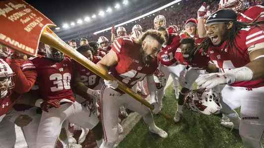 Vince Biegel celebrates with Paul Bunyan's Axe Nov. 2016 after Badgers beat Minnesota. D'Cota Dixon yells Chop, Chop next to him.