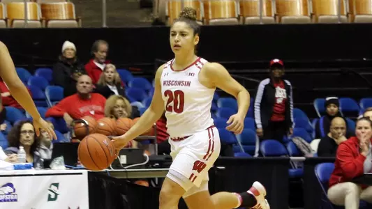 Diamond Bragg brings the ball up the court.