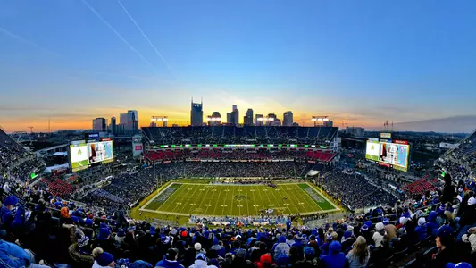 Aerial wideshot photo of the Music City Bowl in Nashville, Tennessee with city skyline behind the stadium