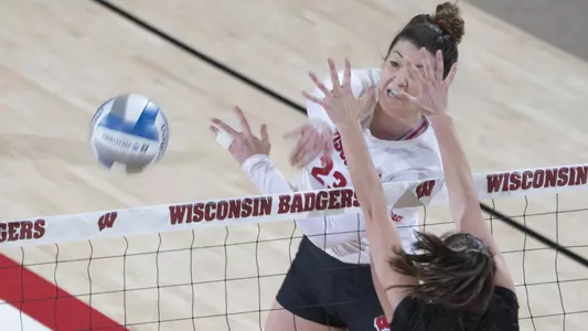 Molly Haggerty attacks the ball against a Green Bay blocker.