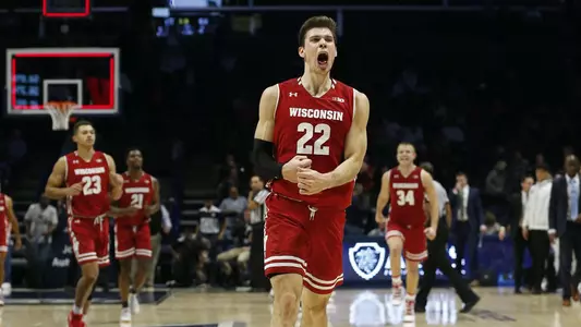 Ethan Happ celebrates durning a men's basketball game vs. Xavier 2018
