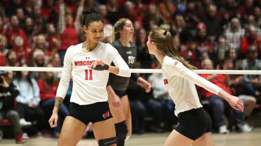 Tionna Williams and Sydney Hilley slap hands during a play vs. Pepperdine.