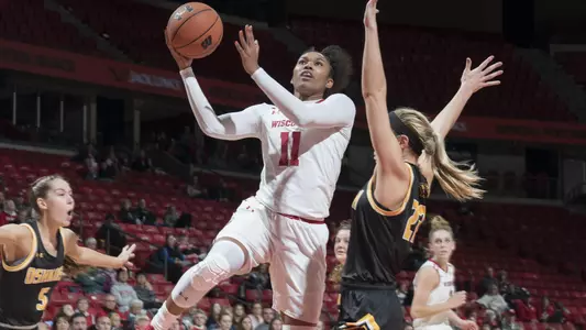 Marsha Howard drives to the hoop against an Oshkosh defender.