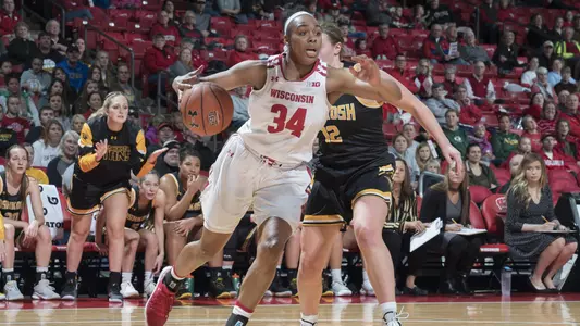 Imani Lewis drives to the basket against an Oshkosh defender.
