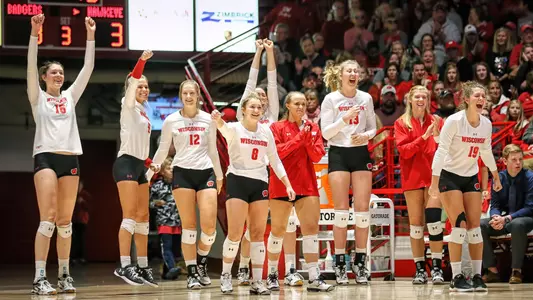 The Badger bench celebrates during a match.