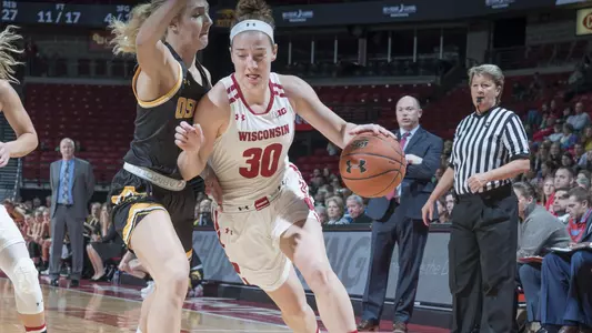 Kara Crowley drives around an Oshkosh defender.