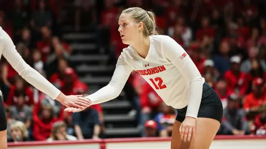 Nicole Shanahan slaps the hand of a teammate