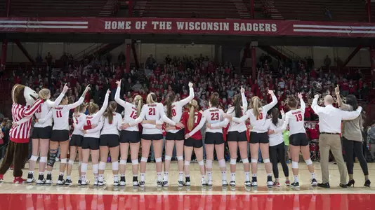 The Badgers sing Varsity after a win in the UW Field House.
