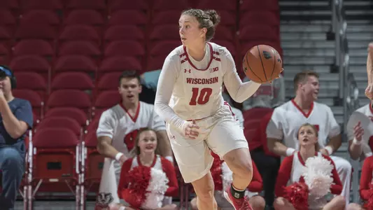 Kendra Van Leeuwen brings the ball up the court.
