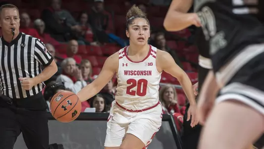 Diamond Bragg brings the ball up the court.