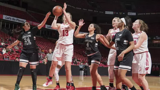Sydney Mathiason shoots for two points under the basket.