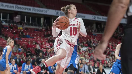 Kendra Van Leeuwen attempts to pass the ball before heading out of bounds.